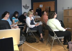 Photo of attendees listening to presentation